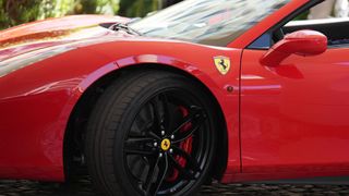 A close up of a red Ferrari sports car