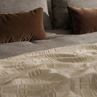 A cream textured throw from McGee & Co.