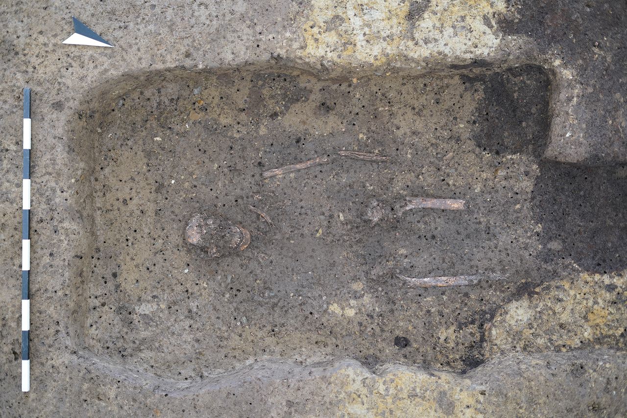 The skeleton of a man in a dirt burial