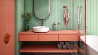 Bold coral bathroom with colored cabinets and mint green walls to highlight common bathroom design mistakes of choosing trends over timeless choices