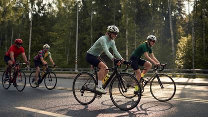 Four cyclists riding on the road