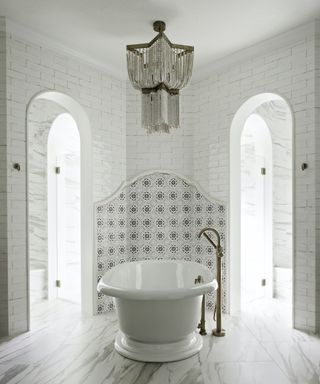 white bathroom with bead chandelier