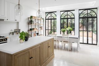 limestone flooring in white kitchen with crittal windows EMR Architecture