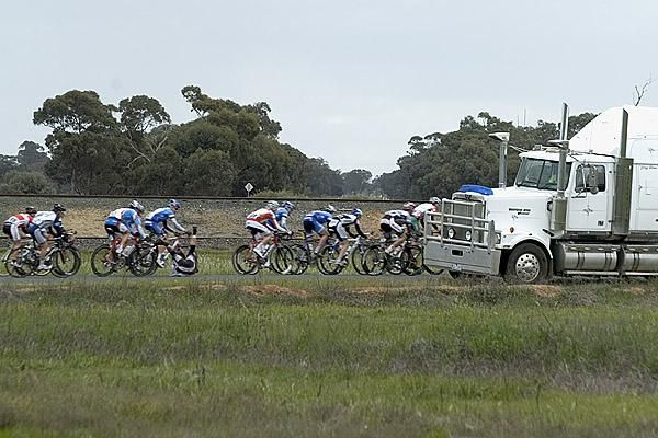 American Curtis Gunn (Fly V Australia) takes a tumble in-front of a truck near Bunaloo on stage three.