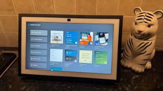 Amazon Echo Show on a counter displaying the widgets library