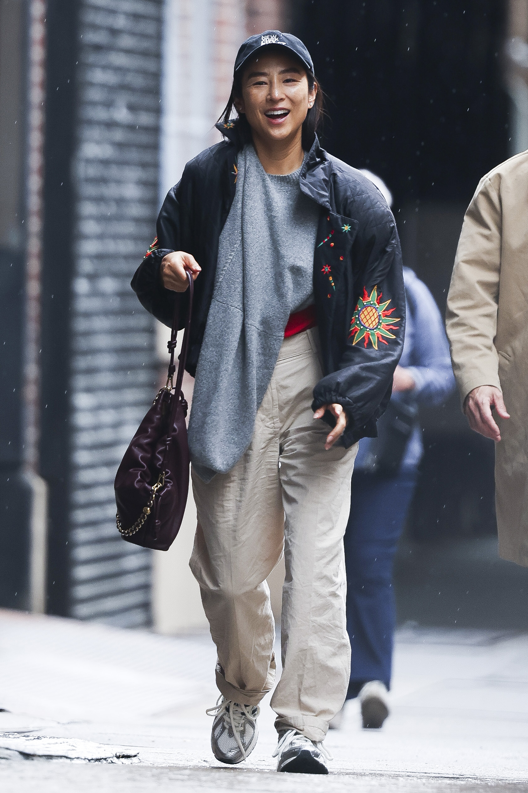 greta lee wears khaki pants with a loewe bag and rare new balance sneakers