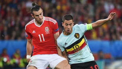 Gareth Bale (left) in action for Wales against Belgium’s Eden Hazard at Euro 2016