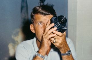 Astronaut Wally Schirra practices using a Hasselblad 500C like the type he flew on Mercury-Atlas 8 in October 1962.