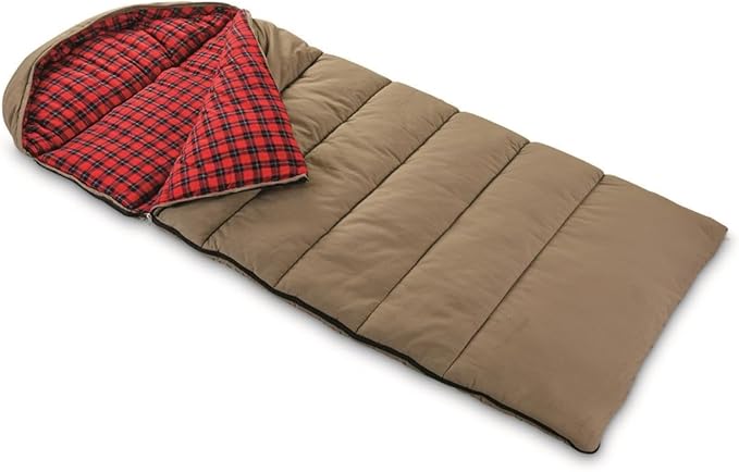 A brown Guide Gear sleeping bag with red plaid interior