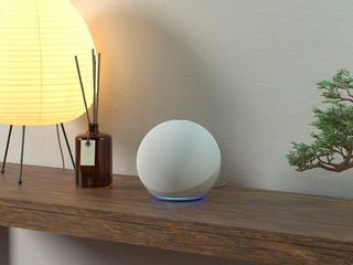 4th Gen Amazon Echo on table with lamp