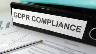 A folder labelled "GDPR Compliance" on a desk