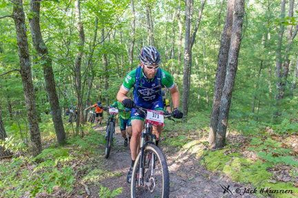 Mike Simonson lap 1 rides up the infamous hike a bike Fire Tower Hill