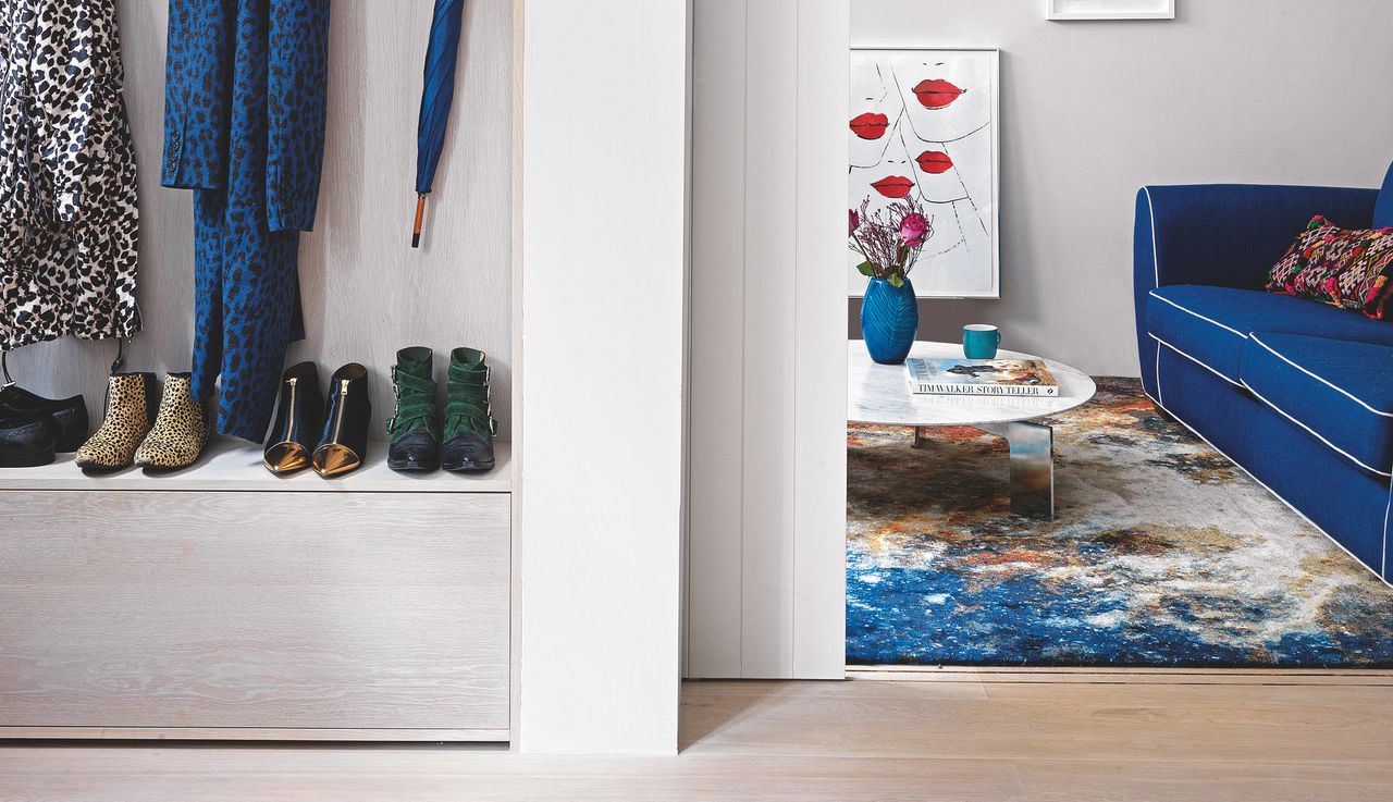 Hallway shoe storage ideas shoe storage on a low cabinet in a white hallway