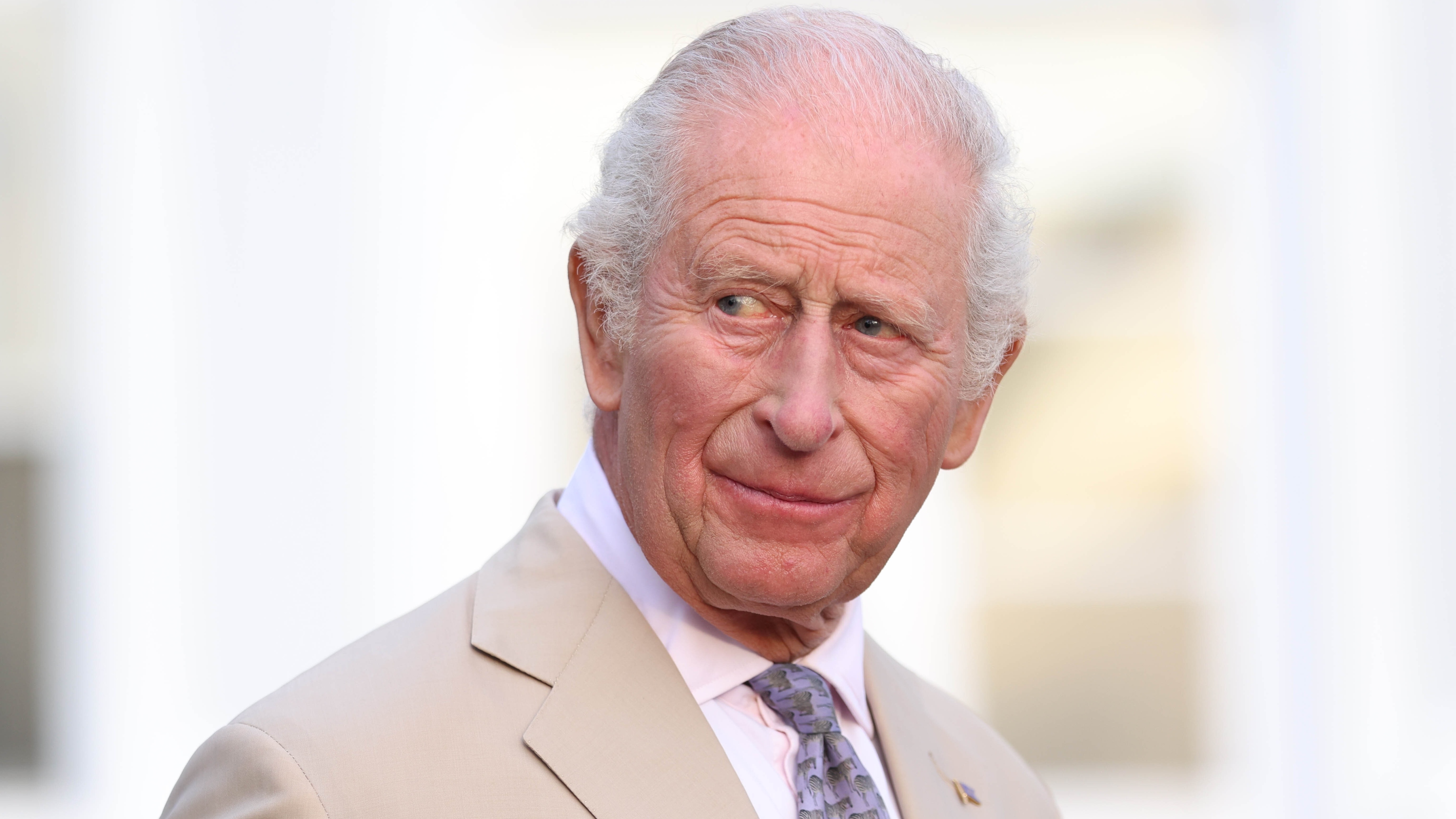 King Charles III speaks during a reception in the garden of Government House on May 1, 2026