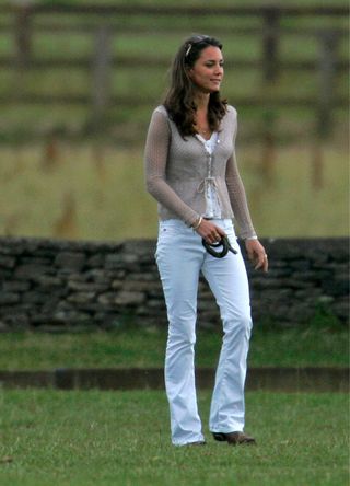Kate Middleton in a pair of white wide-leg trousers