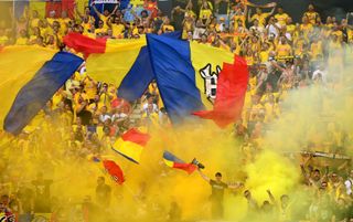 Romania fans light smoke flares during their match against Slovakia at Euro 2024.