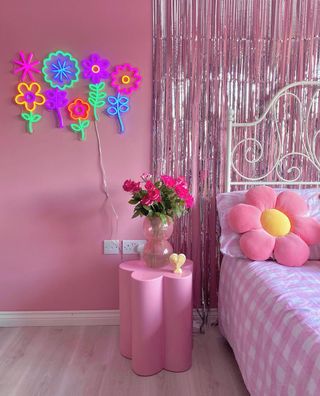 Pink bedroom with tinsel curtain wall