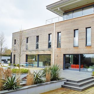 house exterior openness with glass balustrade