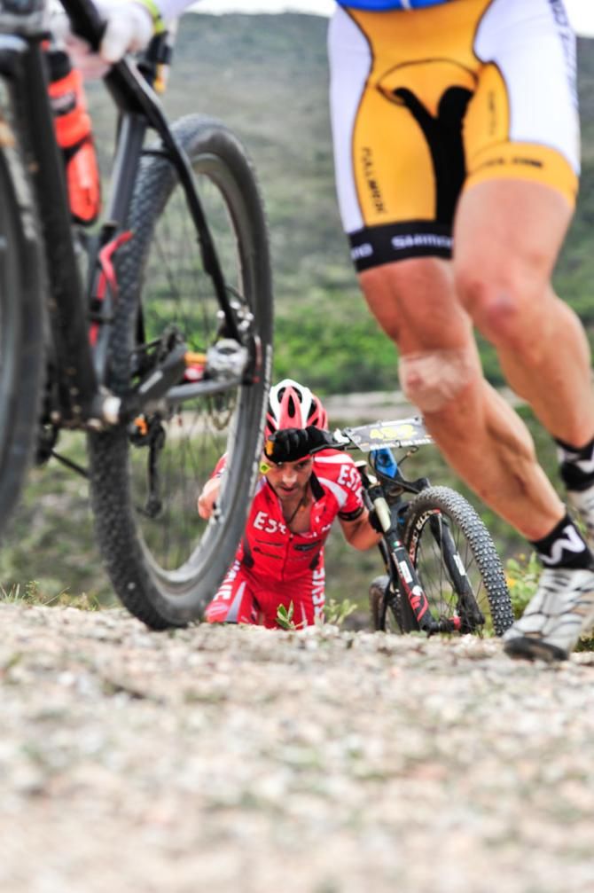 A rider runs on the climb