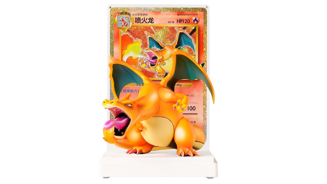 A Charizard figure on a base in front of a Chinese Charizard Pokemon TCG card