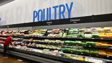 A shopper browses near the poultry section at a Walmart 