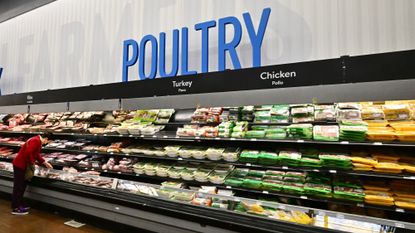 A shopper browses near the poultry section at a Walmart 