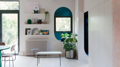 Blue arch mirrors placed around a kitchen window