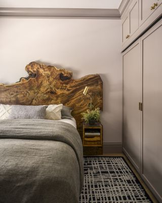 A bedroom with live edge headboard