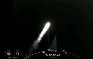 A SpaceX Falcon 9 rocket launches on its 11th mission, a record for a single booster, carrying 52 Starlink internet satellites into orbit from Vandenberg Space Force Base in California on Dec. 18, 2021.