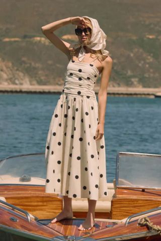 model wearing nobody's child polka dot dress