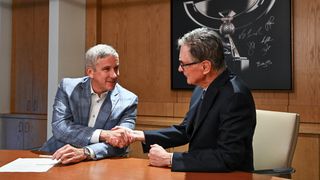 Jay Monahan and John Henry shake on the Strategic Sports Group's deal with the PGA Tour