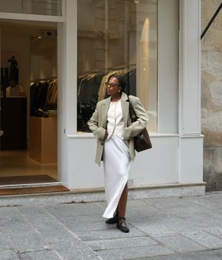 Simple autumn outfits: @nnennaechem wears a blazer with a mini dress and loafers