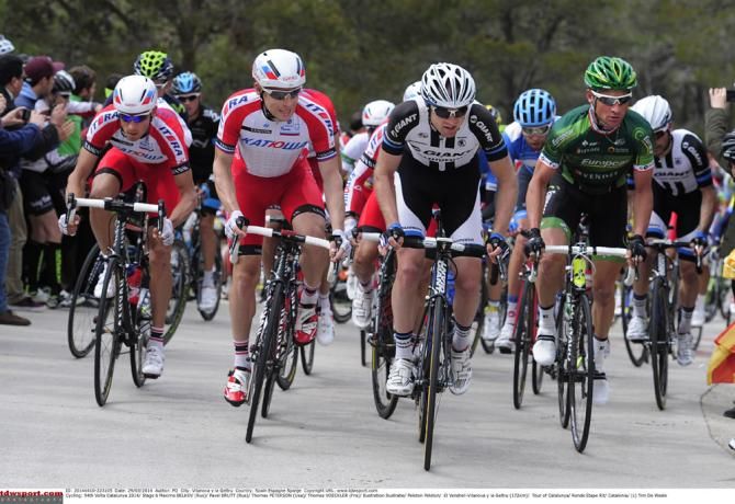 Katusha's Maxim Belkov and Pavel Brutt, Thomas Peterson (Giant-Shimano) and Thomas Voeckler (Europcar) at the front of the peloton