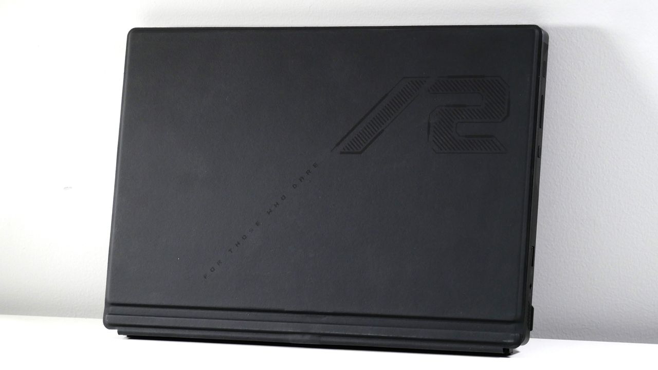 Asus ROG Flow Z13 (2025) closed against a white hall, highlighting the underside of the keyboard.