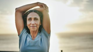 A woman stretches outdoors