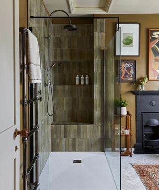 Modern rustic bathroom with dark green tiles