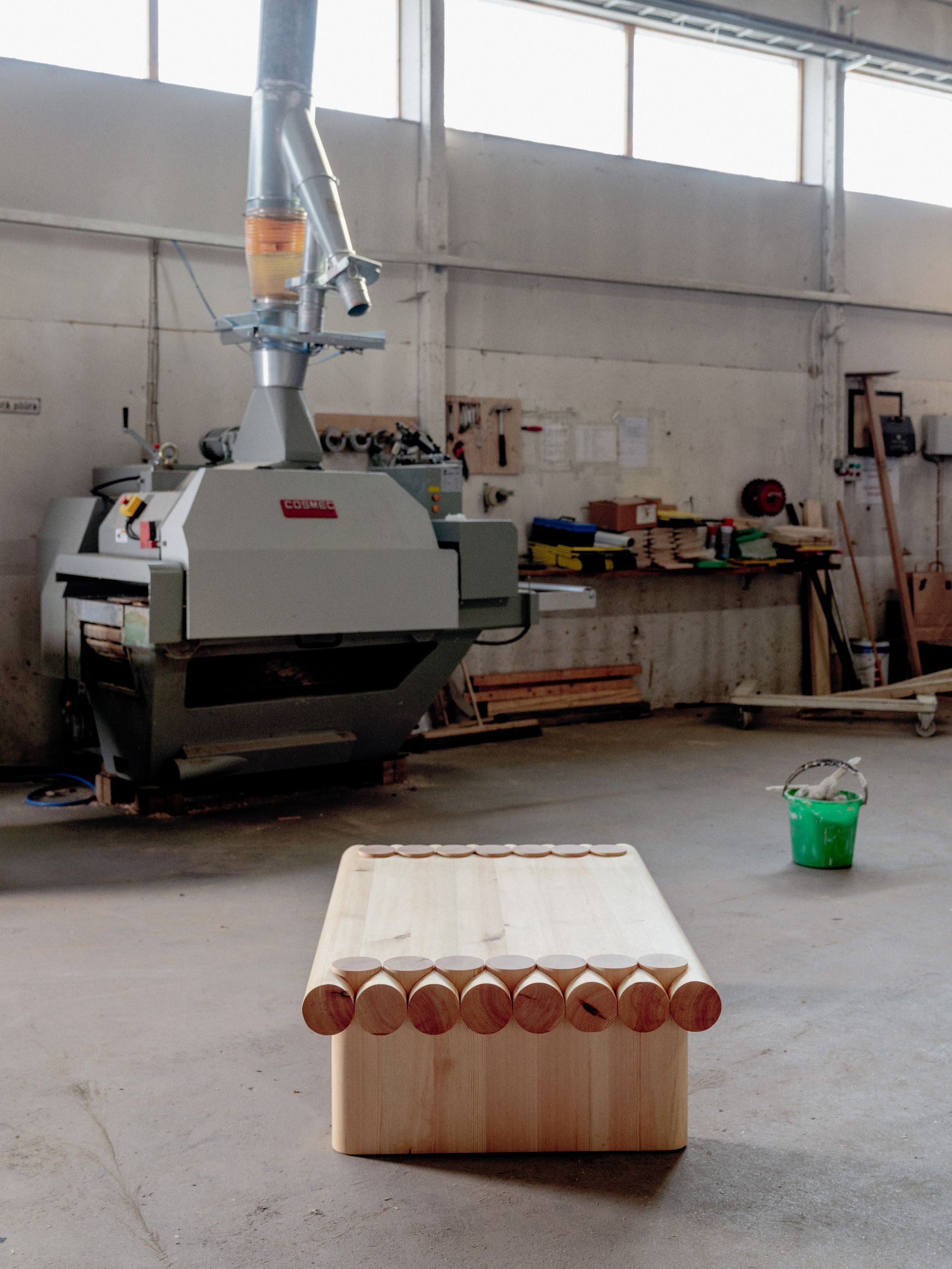 Wooden coffee table by Finnish design brand Vaarnii photographed in factory