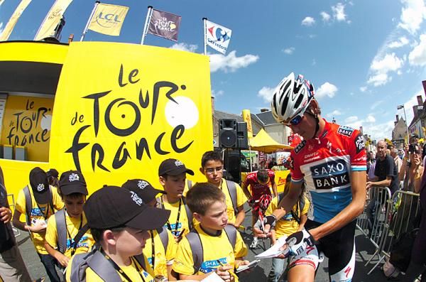 Andy Schleck signs autographs at the start of stage 11.
