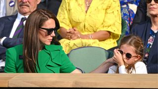 Catherine, Princess of Wales and Princess Charlotte of Wales cheer watching Carlos Alcaraz vs Novak Djokovic in the Wimbledon 2023 men's final on Centre Court during day fourteen of the Wimbledon Tennis Championships at the All England Lawn Tennis and Croquet Club on July 16, 2023 in London, England