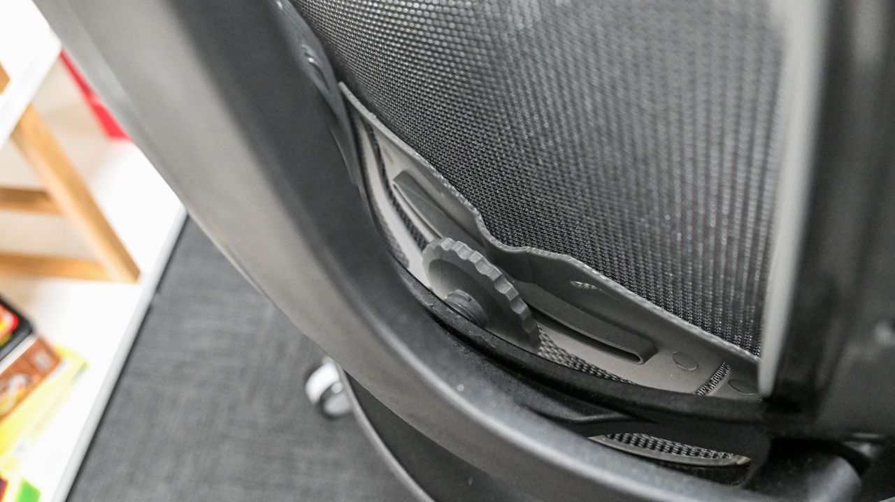 Lumbar support adjustment wheel on the rear of the Desky Pro Plus Ergonomic Chair