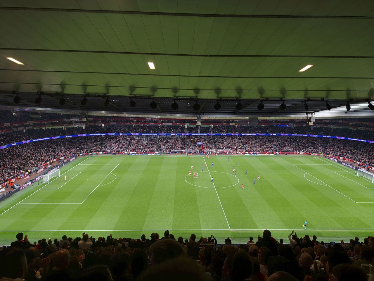 Action photos during a Champions League soccer match at Arsenal's Emirates stadium, taken with the Oppo Find X9 Ultra and teleconverter lens