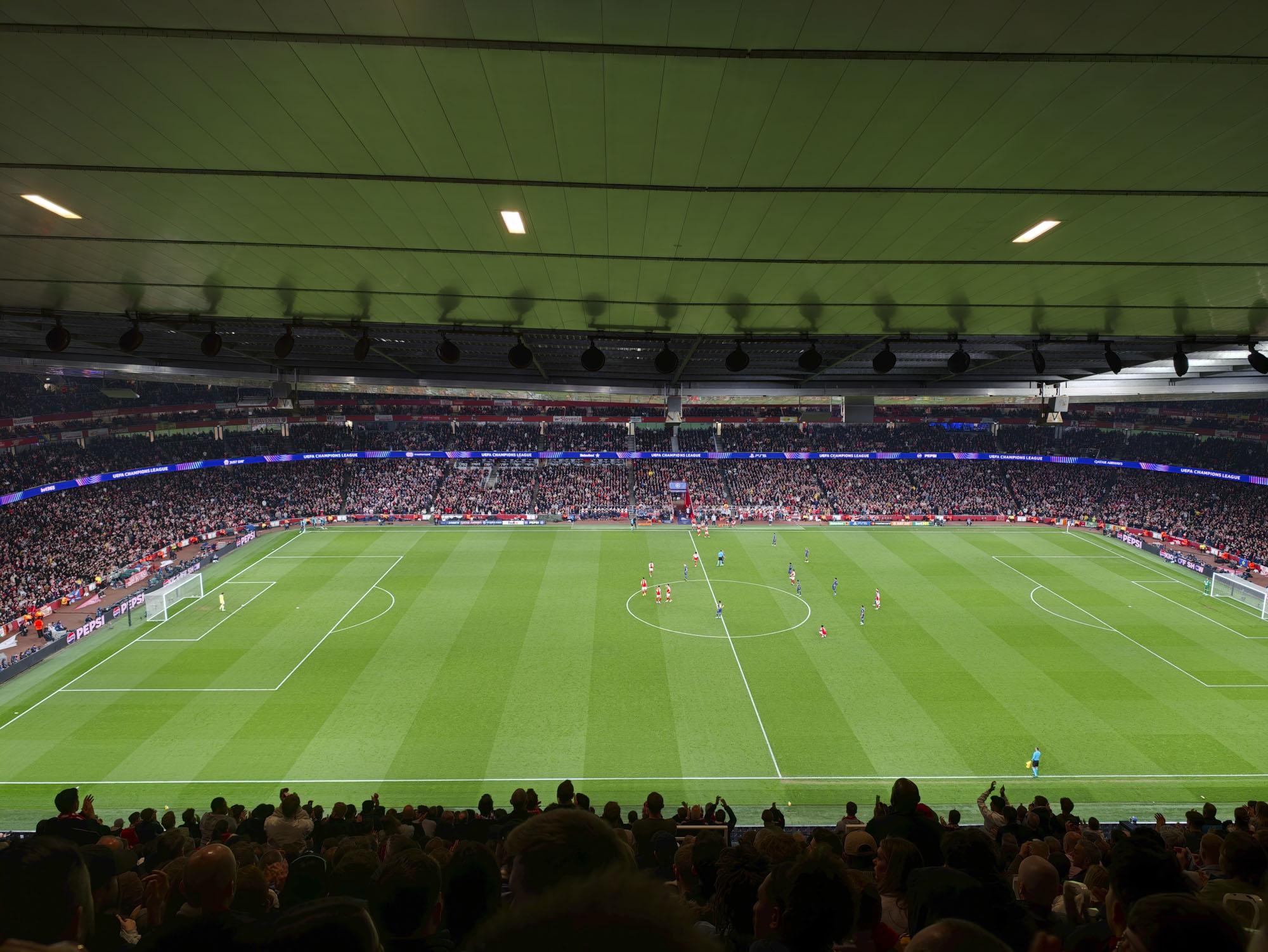 Action photos during a Champions League soccer match at Arsenal's Emirates stadium, taken with the Oppo Find X9 Ultra and teleconverter lens