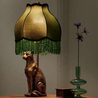 Surrealist leopard motif table lamp.