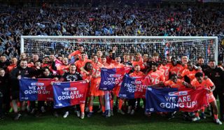 Coventry City players and staff celebrate with the fans at Ewood Park after their 1-1 draw with Blackburn Rovers sealed promotion to the Premier League
