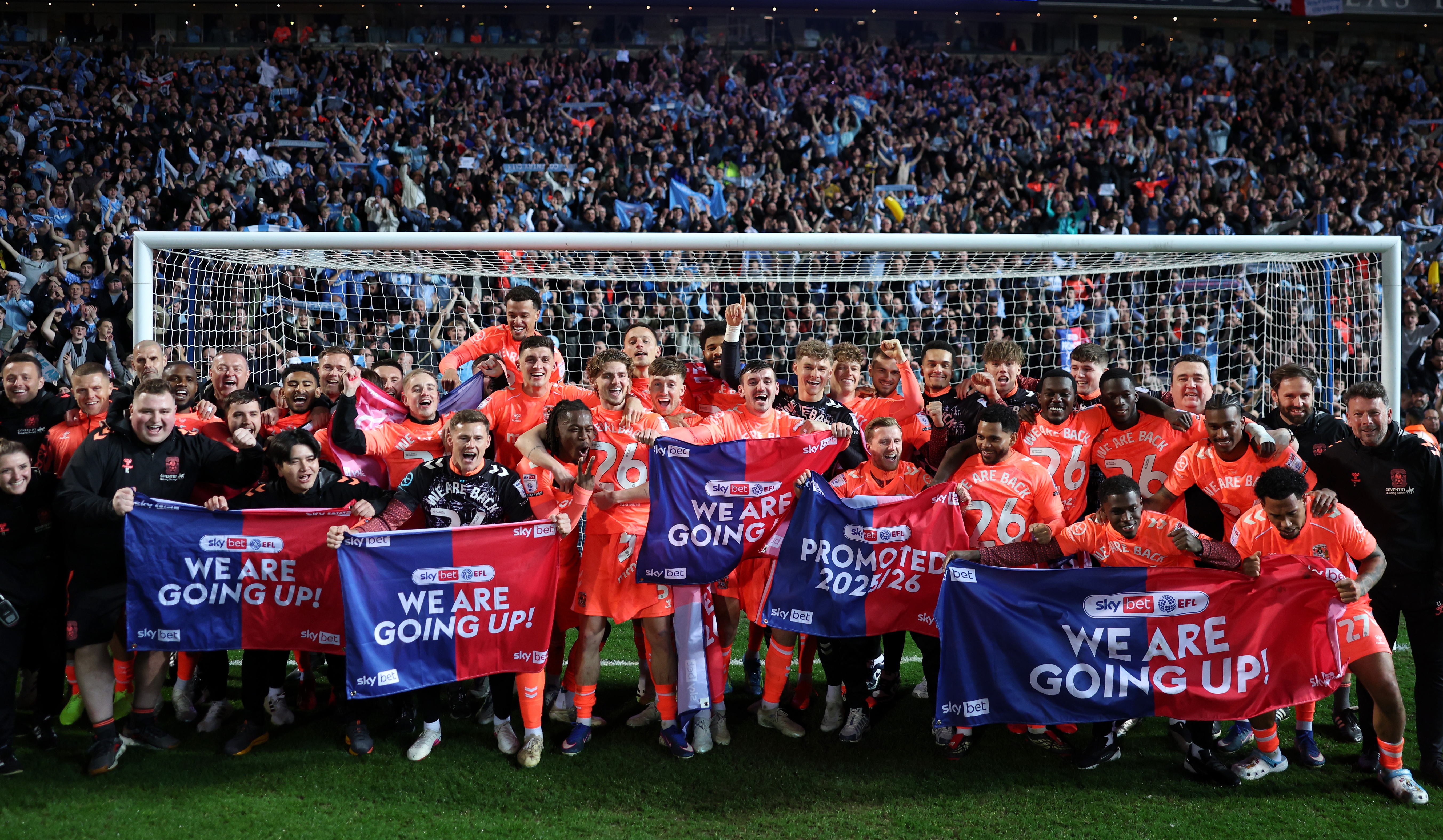 Coventry City players and staff celebrate with the fans at Ewood Park after their 1-1 draw with Blackburn Rovers sealed promotion to the Premier League