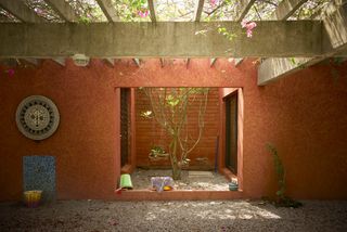 ivory coast house with terracotta coloured walls