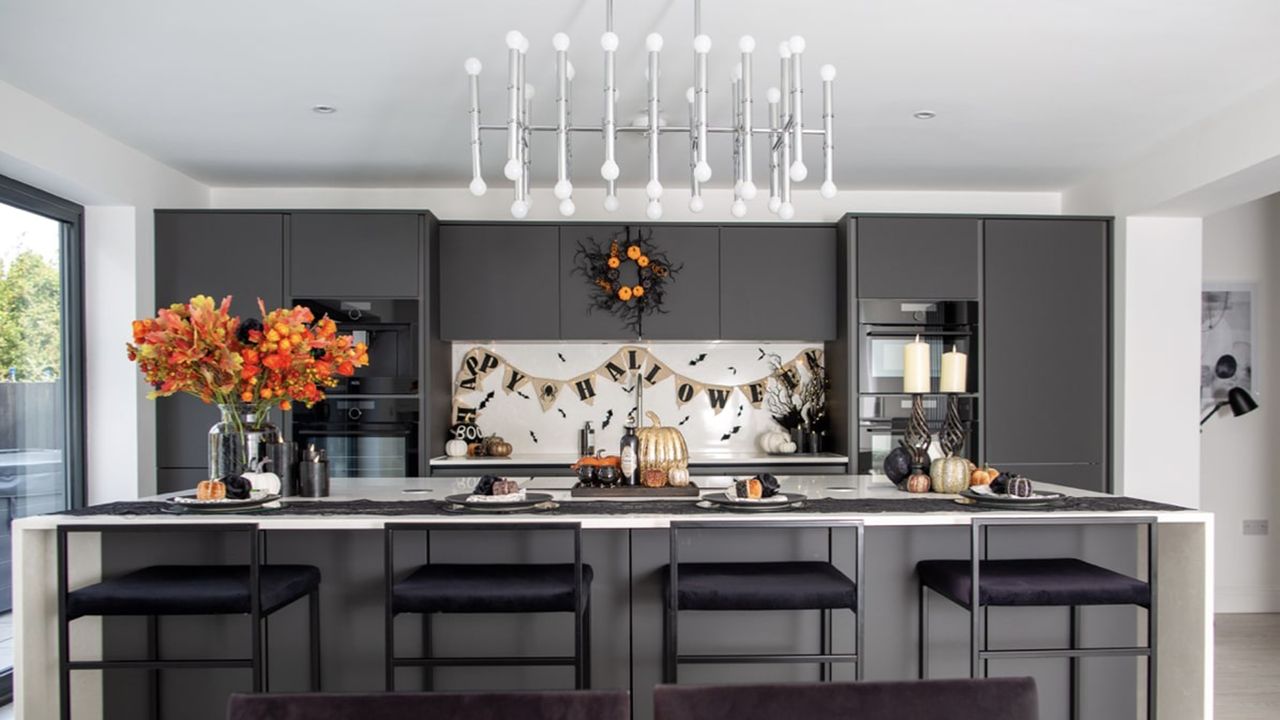 A black kitchen with assortment of seasonal Halloween decor