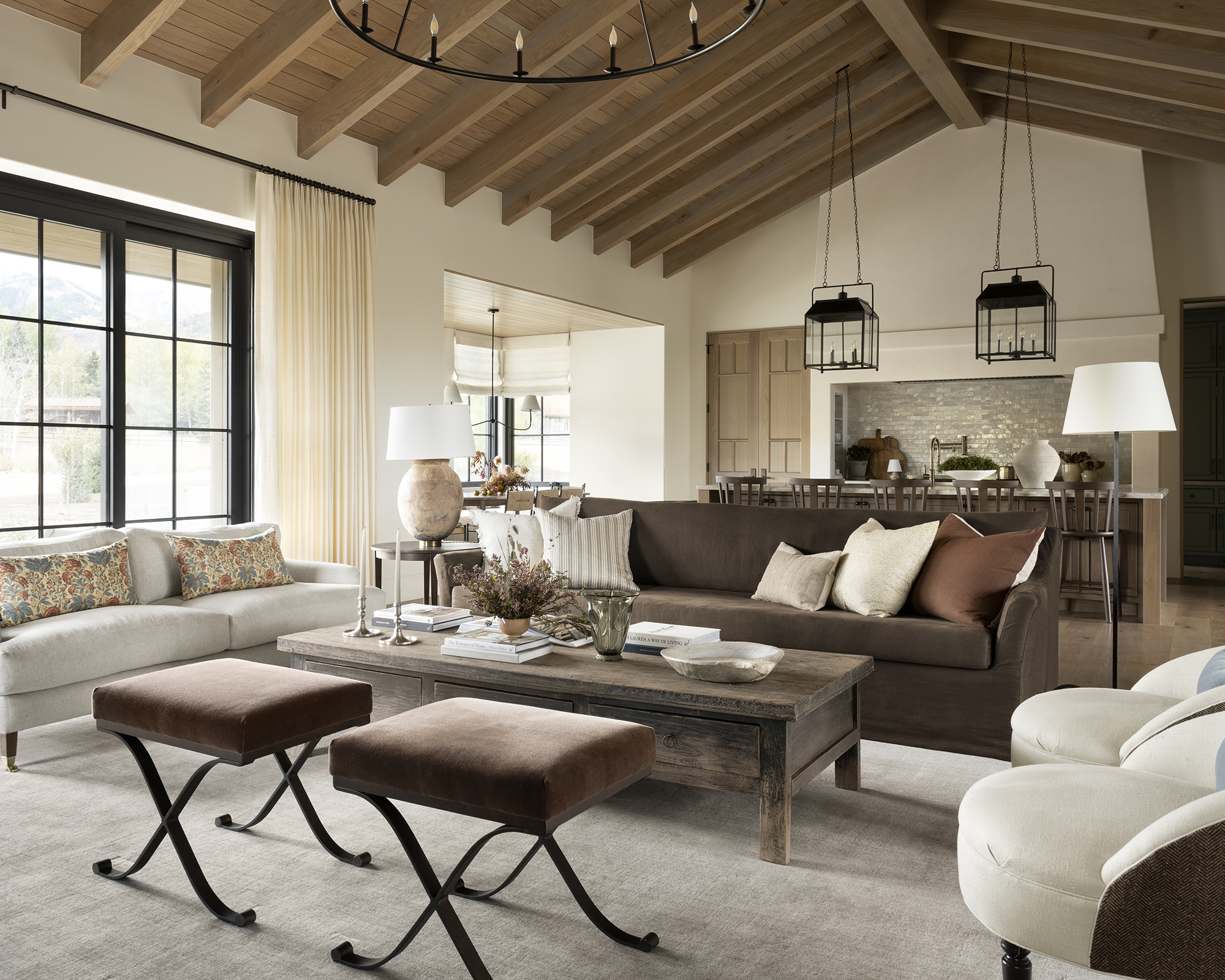 open plan kitchen living room with wood beams on the ceiling