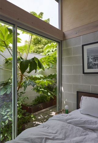 The outdoor bath can be seen beyond the main bedroom