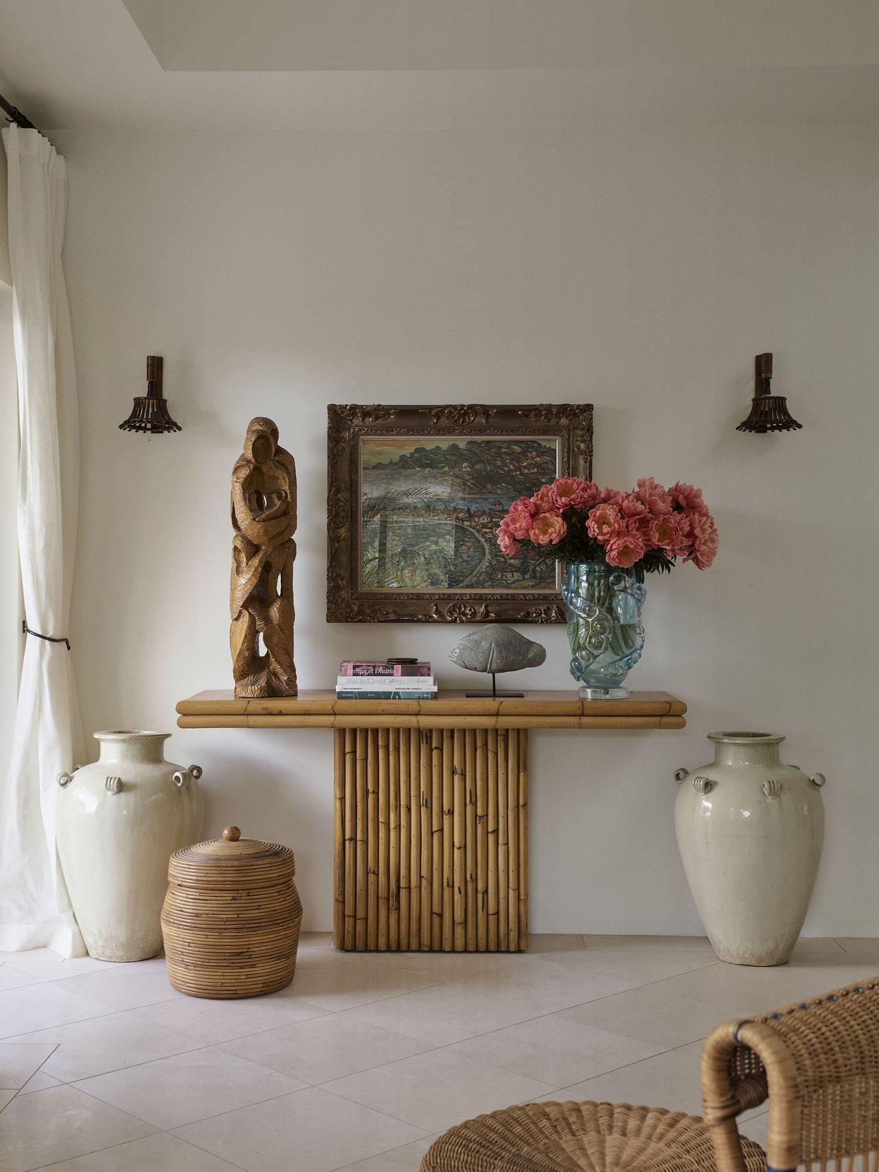 A hallway table with decorative objects